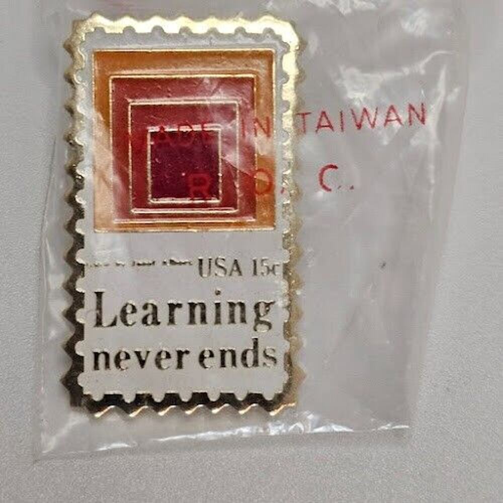 "Learning never ends" USA 15c Stamp Lapel Pin Commemorative 1.25 in X .5 in